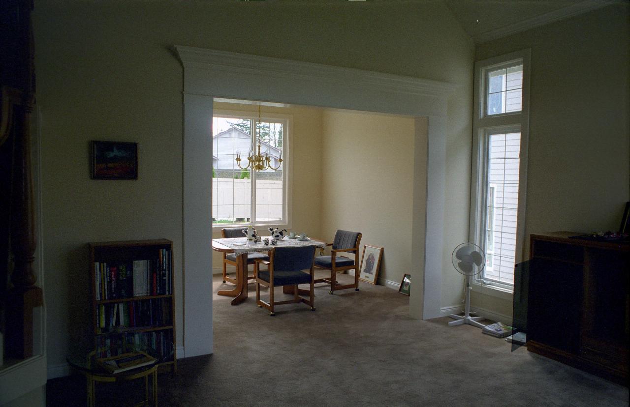 Emtpy formal living and messy dining room