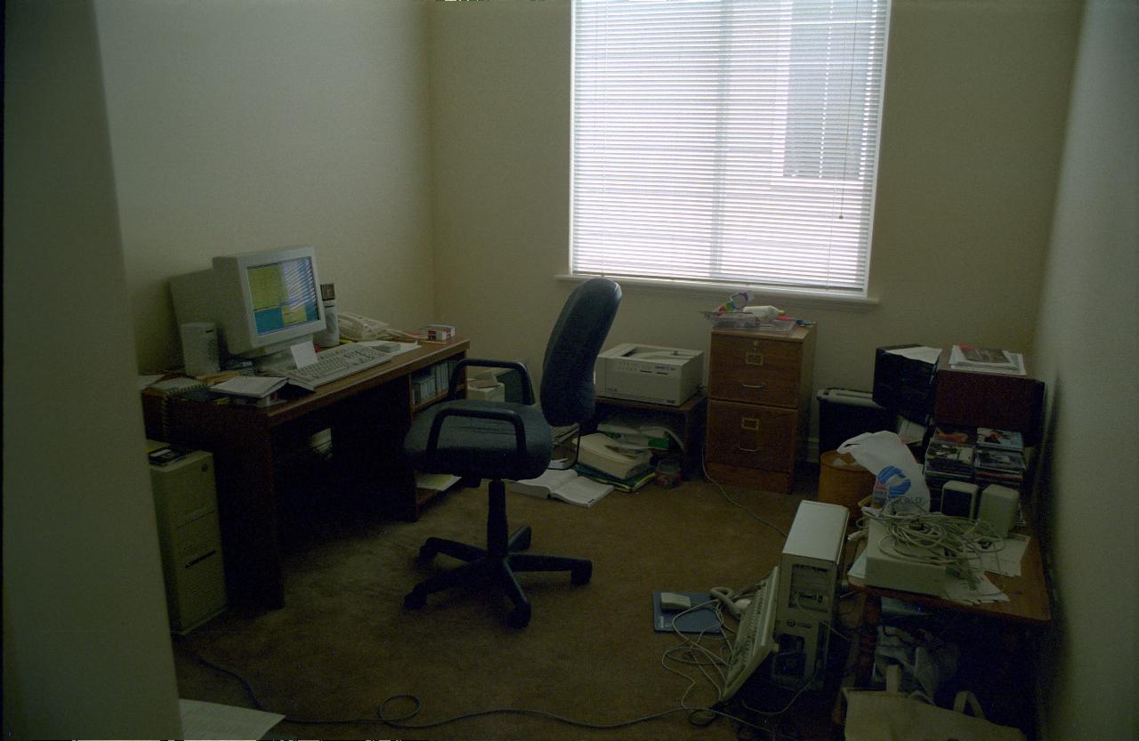 Desk and computer stuff all around