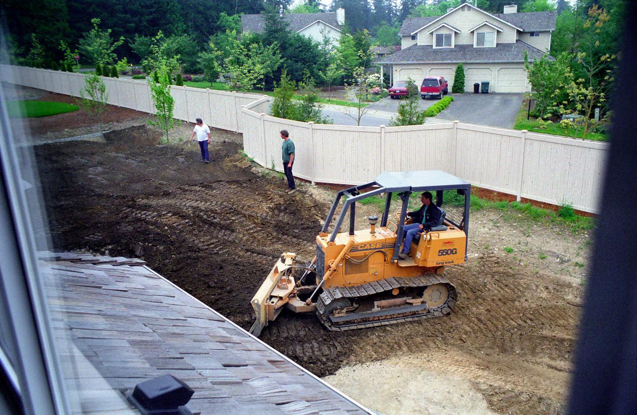 Grader in my back yard