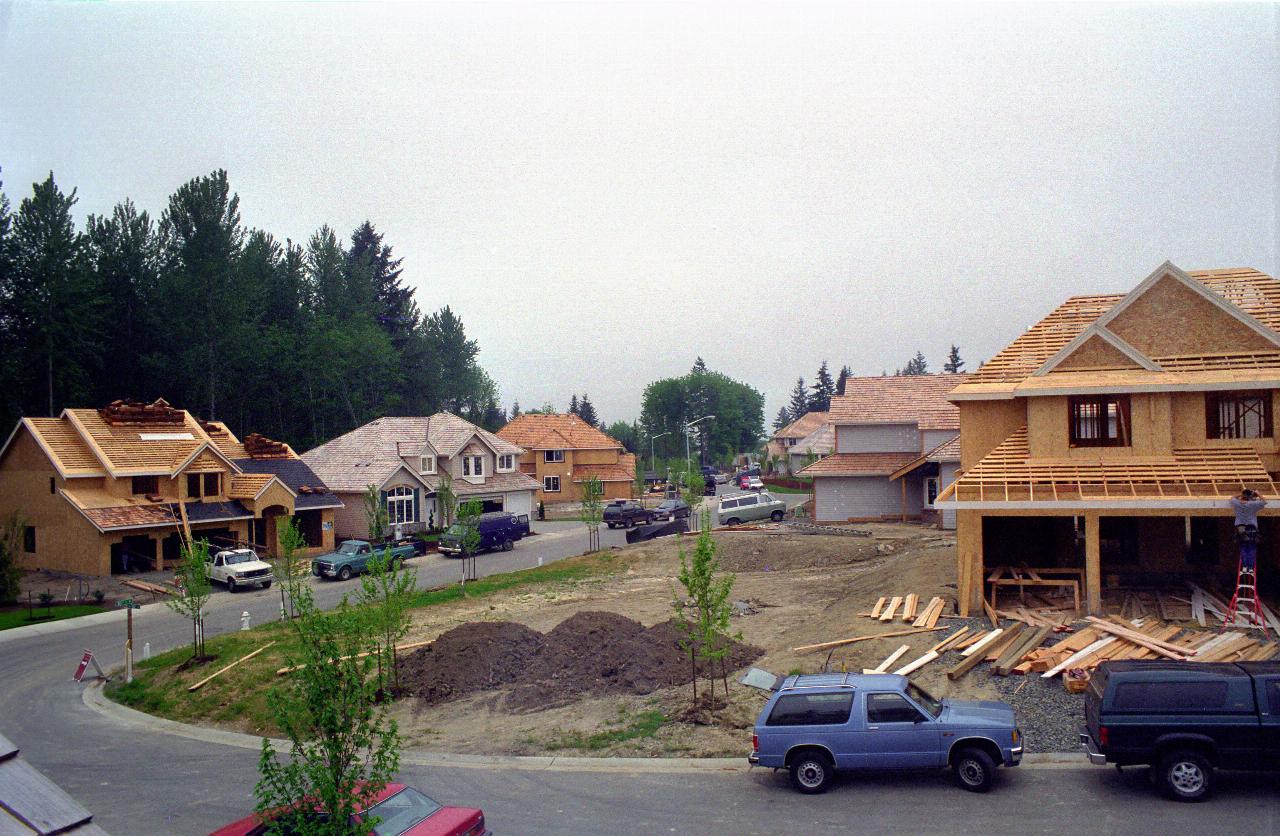 04May98: Lot 39's wall back in place, and roof being installed