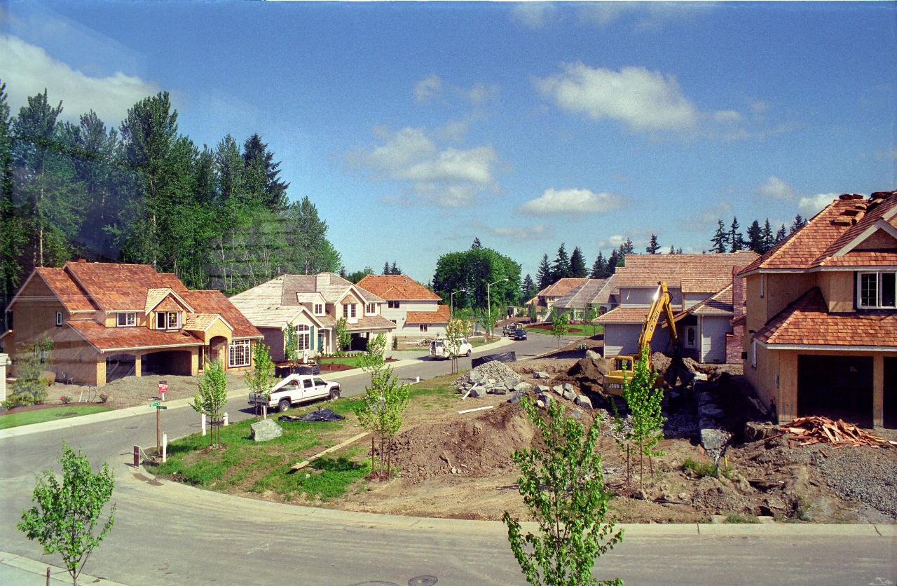 Lots 11 and 39 have roofs; starting retaining wall for lot 12