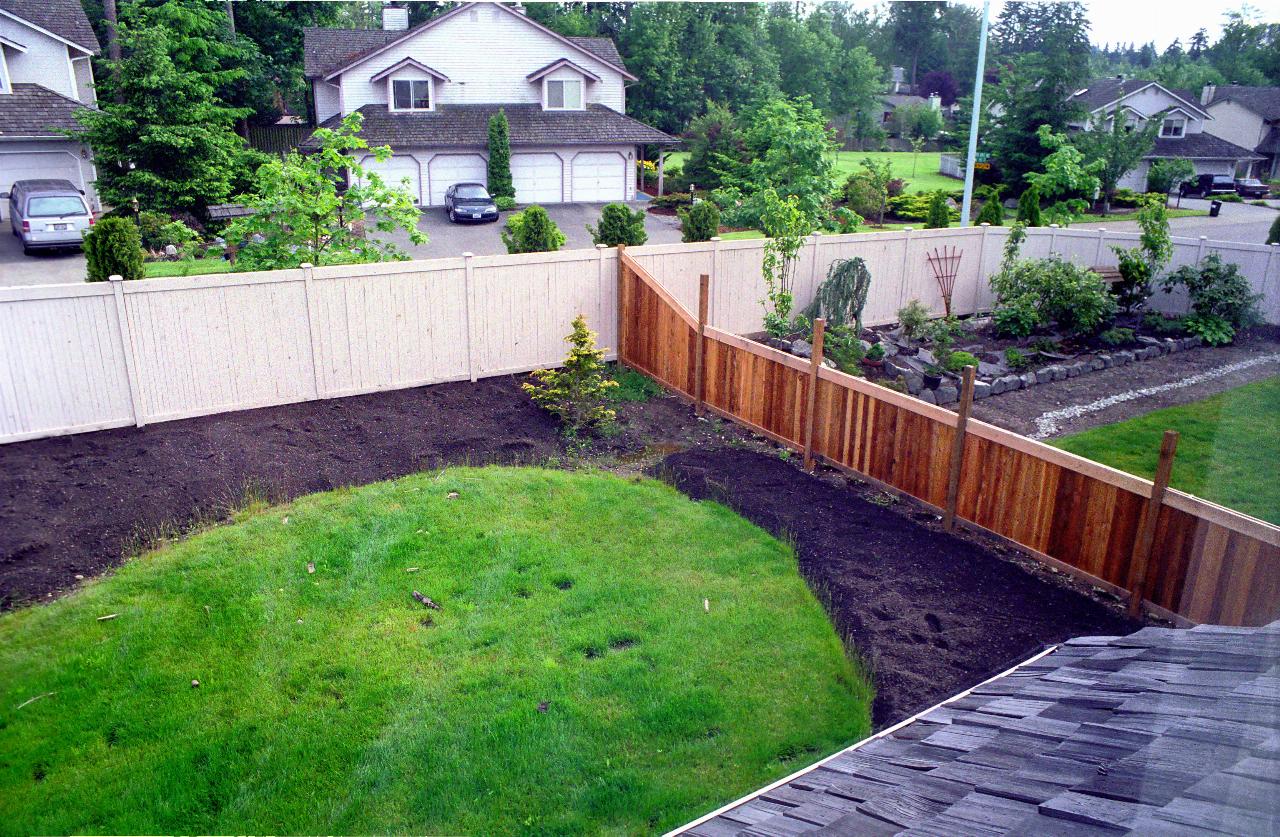  Back yard showing dirt placed on gardens, looking SW