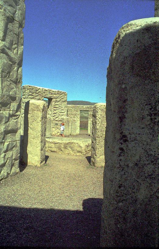 View through stone columns to horizontal stone used as altar