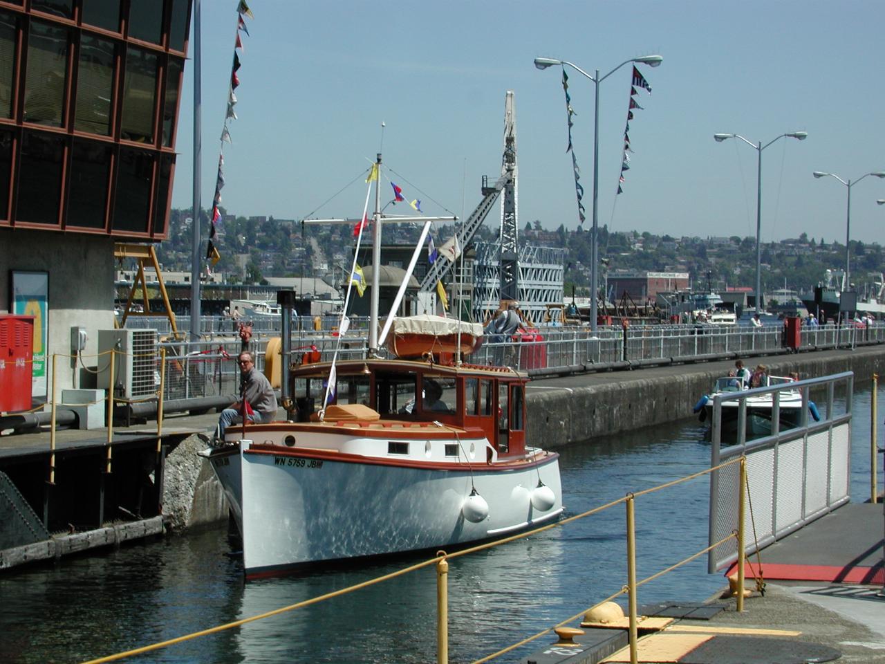 Lovely wooden cabin cruiser entering the lock