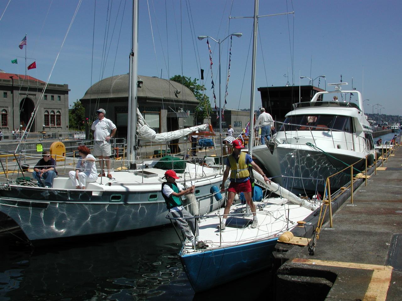 Modern yachts and powered craft moving into lock