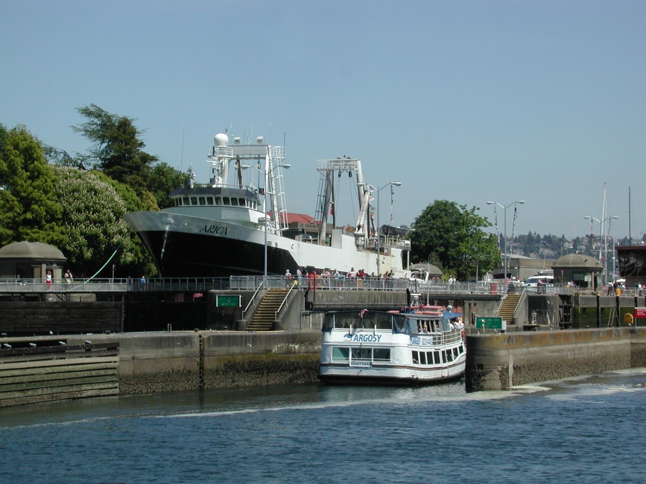 Tourist vessel entering small lock, which Arica waits in large lock next to it