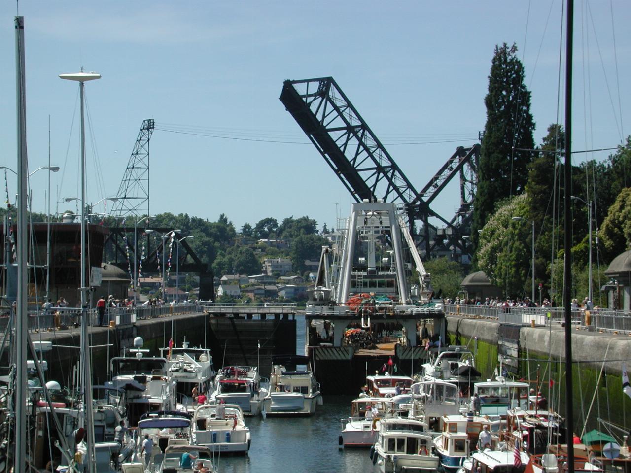 Pleasure craft in the large lock wait behind Arica to exit the lock as the Puget Sound end gates open