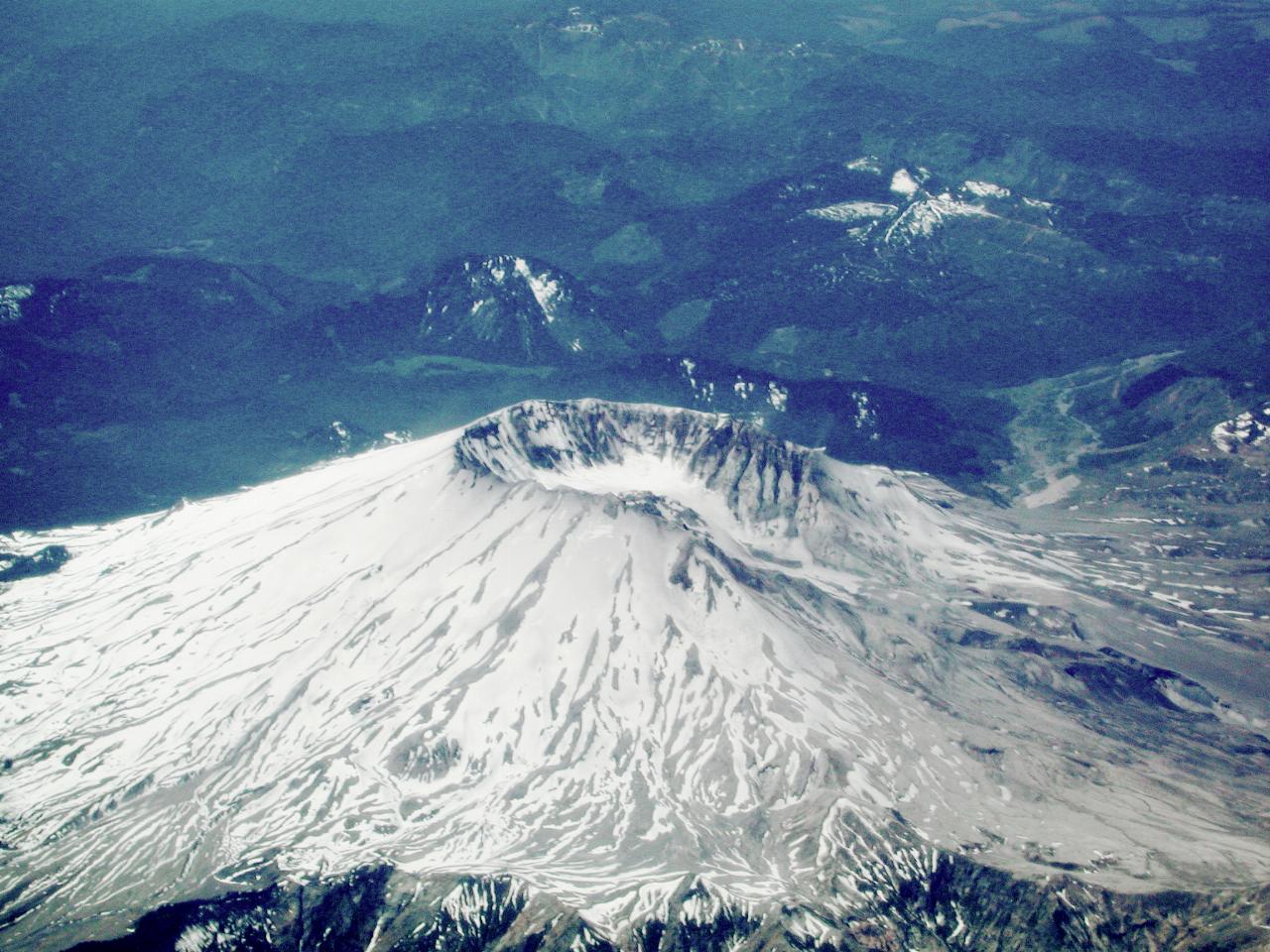 Snow covered volcano with missing side