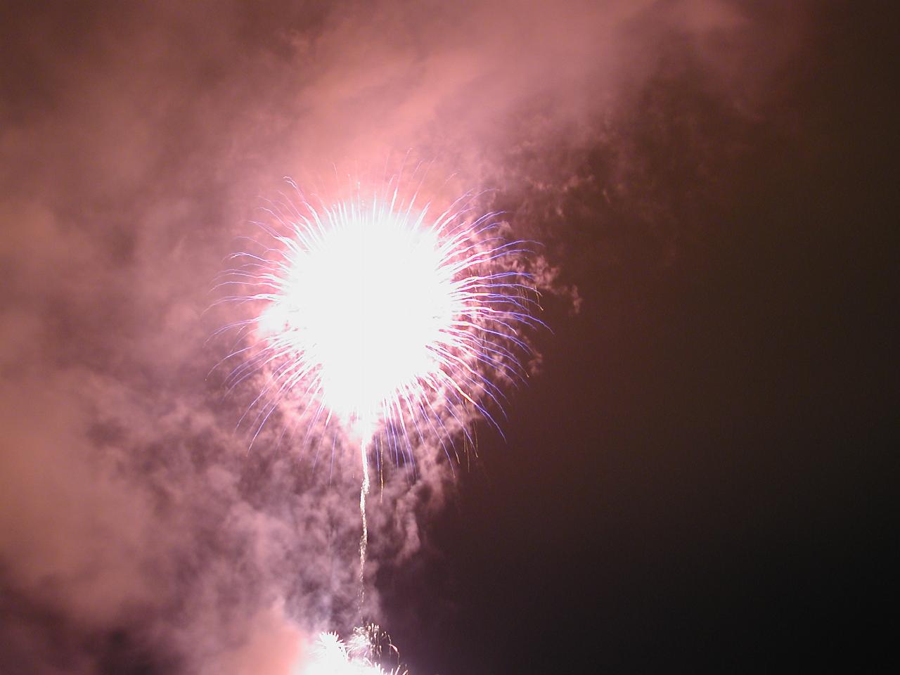 A white blob surrounded by smoke