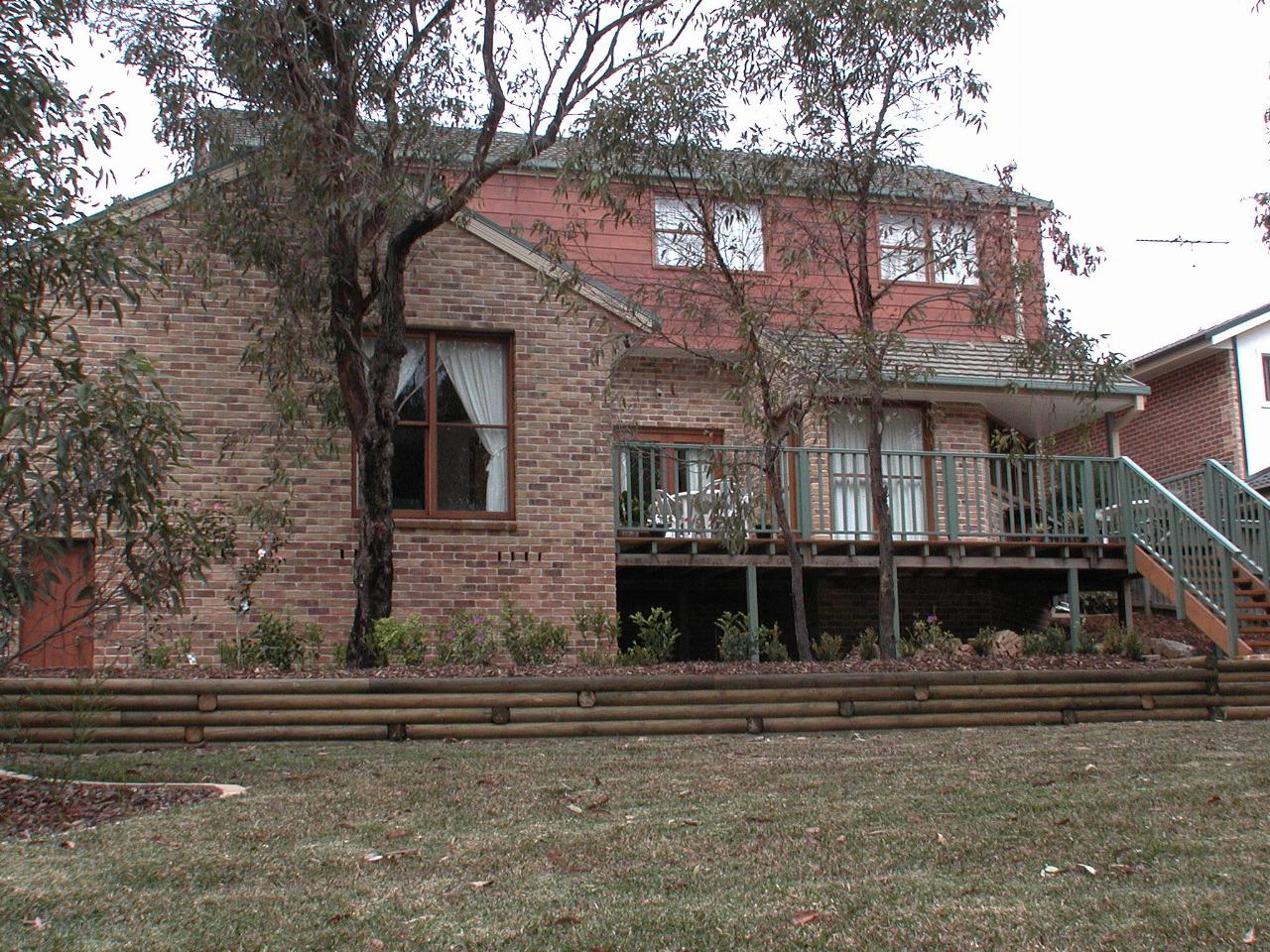 Rear of the house, including staircasse from deck to lawn