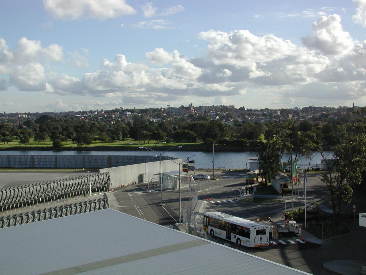 Airport buildings leading to river and green golf course on the far side