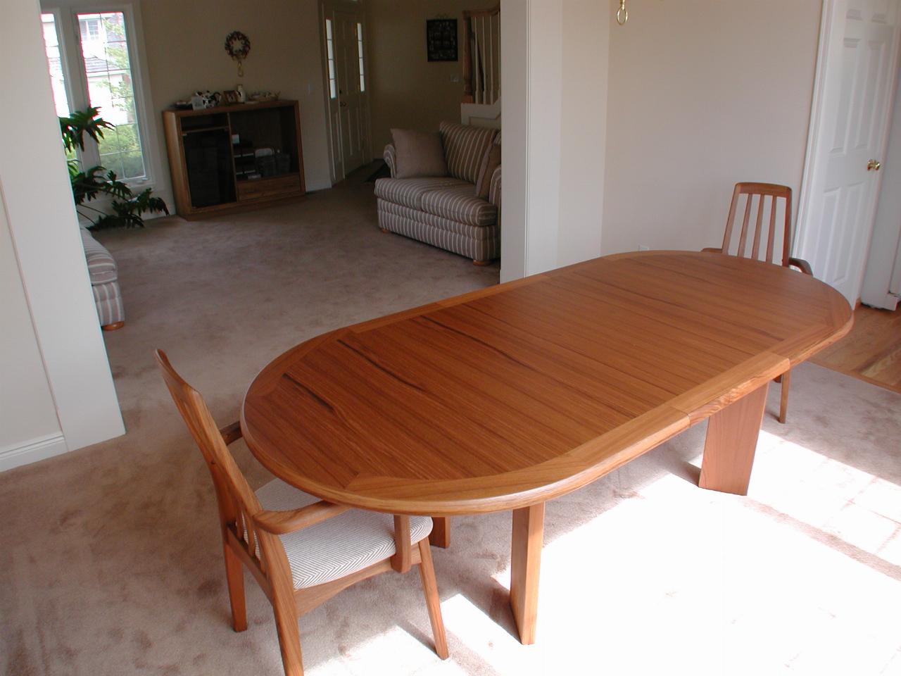 Dining table and two chairs with view to living room