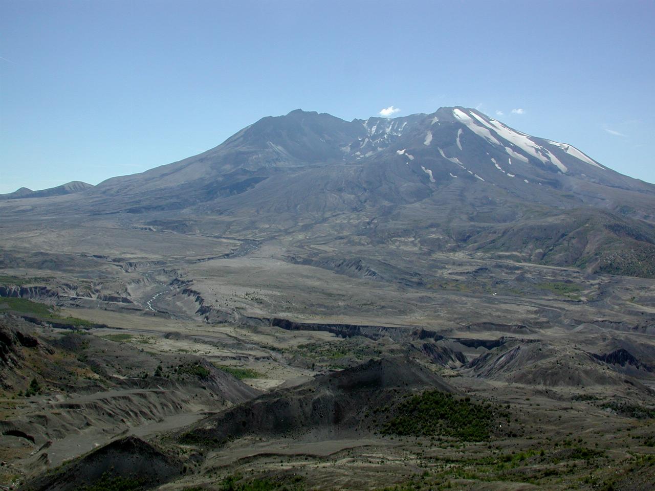 Barren land leading to volcano with side missing