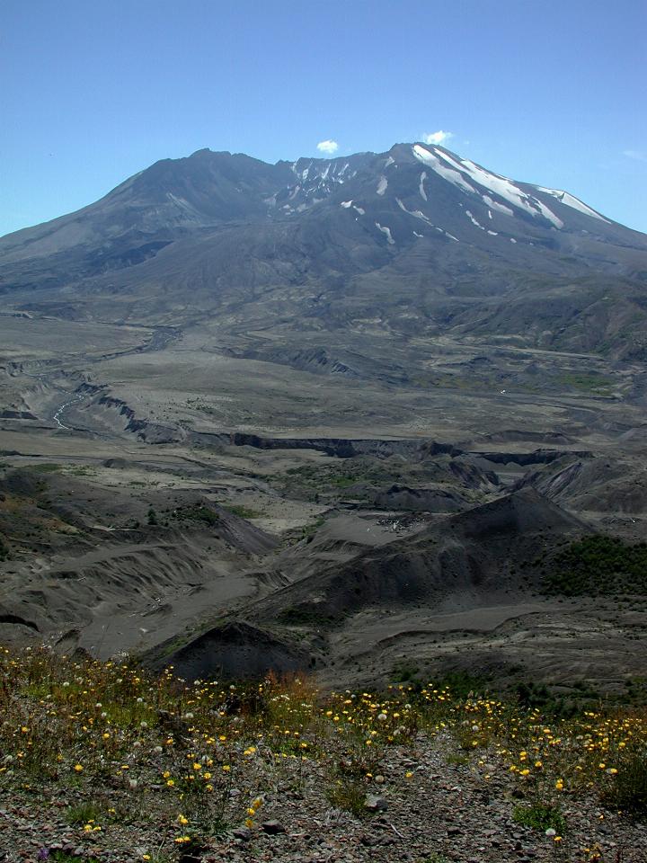 Barren land leading to volcano with side missing