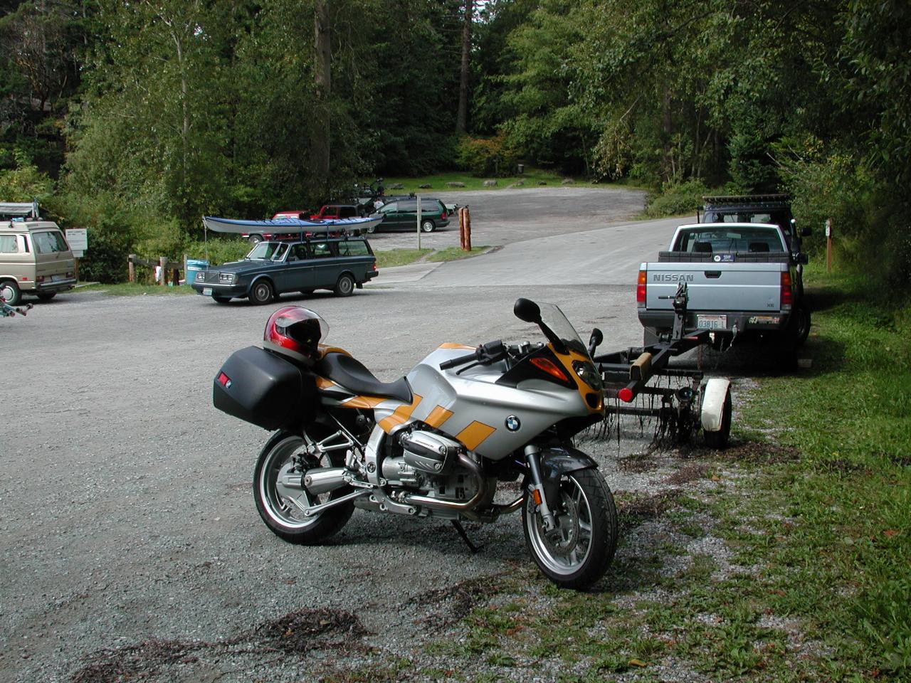 Silver/yellow BMW R1100S parked in boat launching area