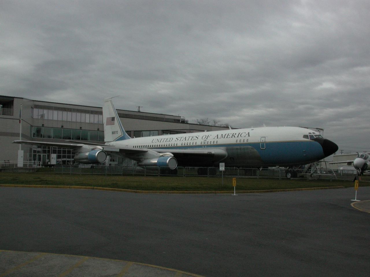 Boeing 707 outside 3 storey building