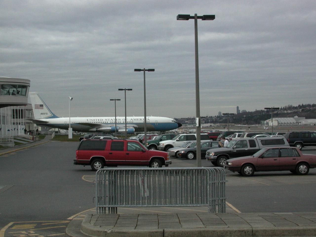 View over cars towards Boeing 707