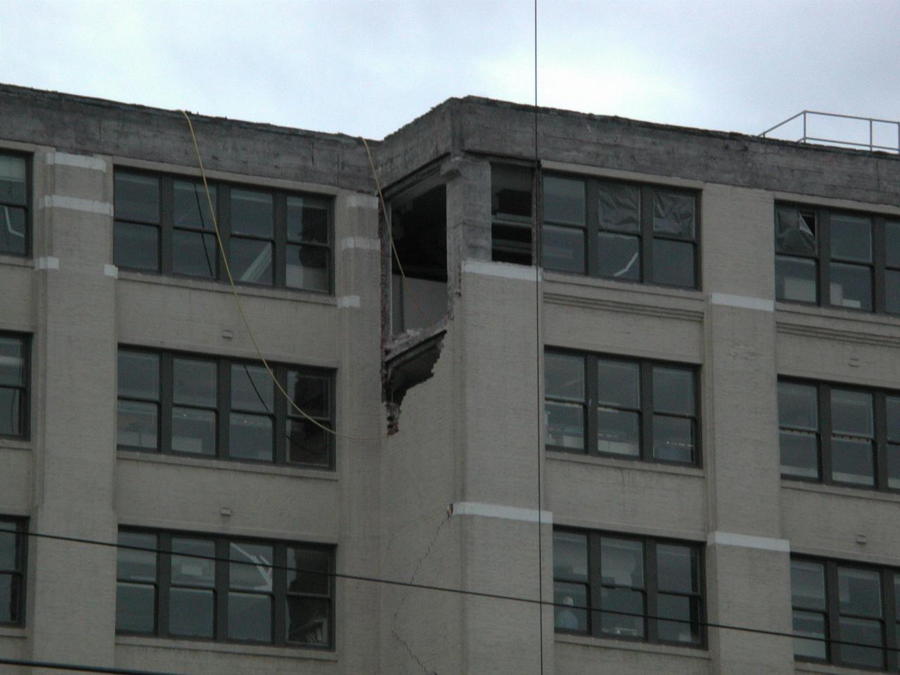 Starbucks building after the quake, undergoing repair