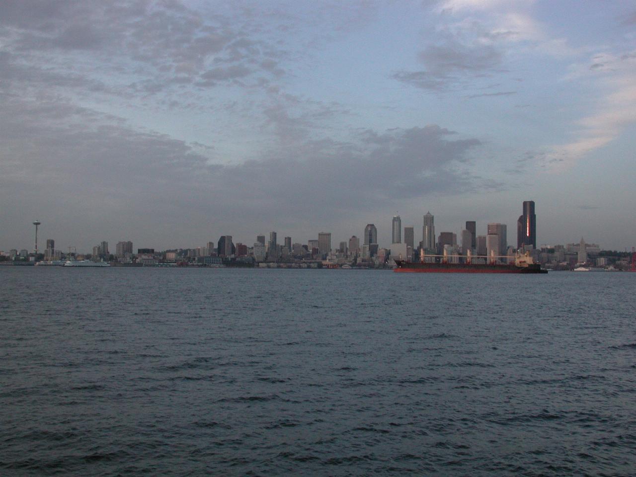 Wide angle view of downtown Seattle, with the last rays of the sun reflecting from buildings.