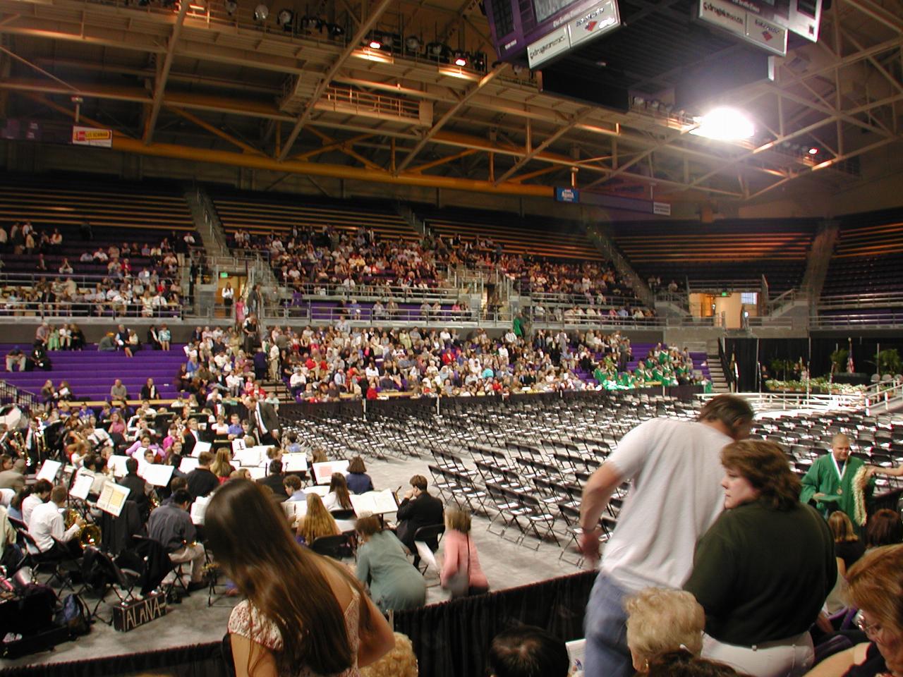 Settling in, with band, choir in far corner (in green)