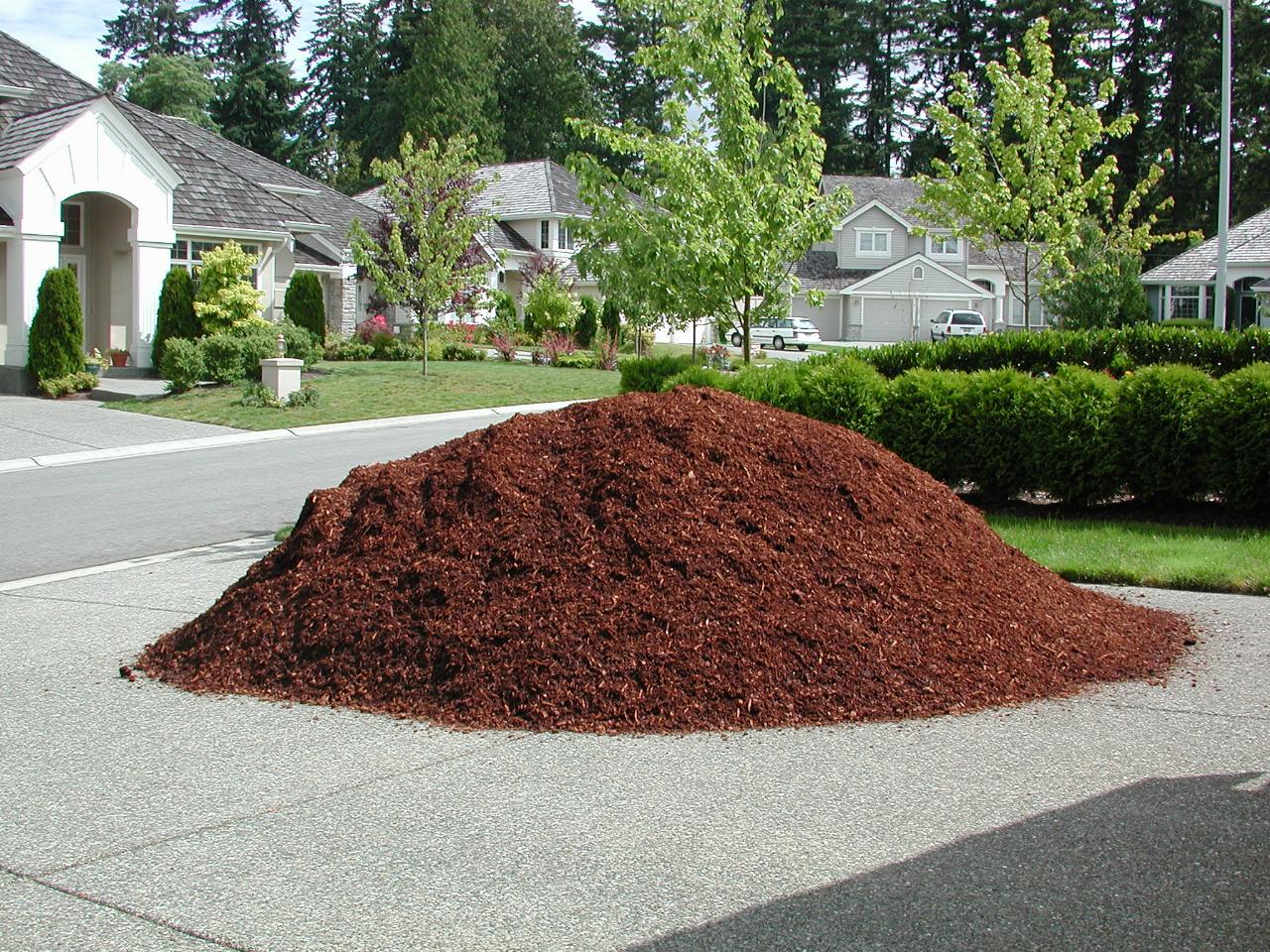 Pile of red bark on driveway