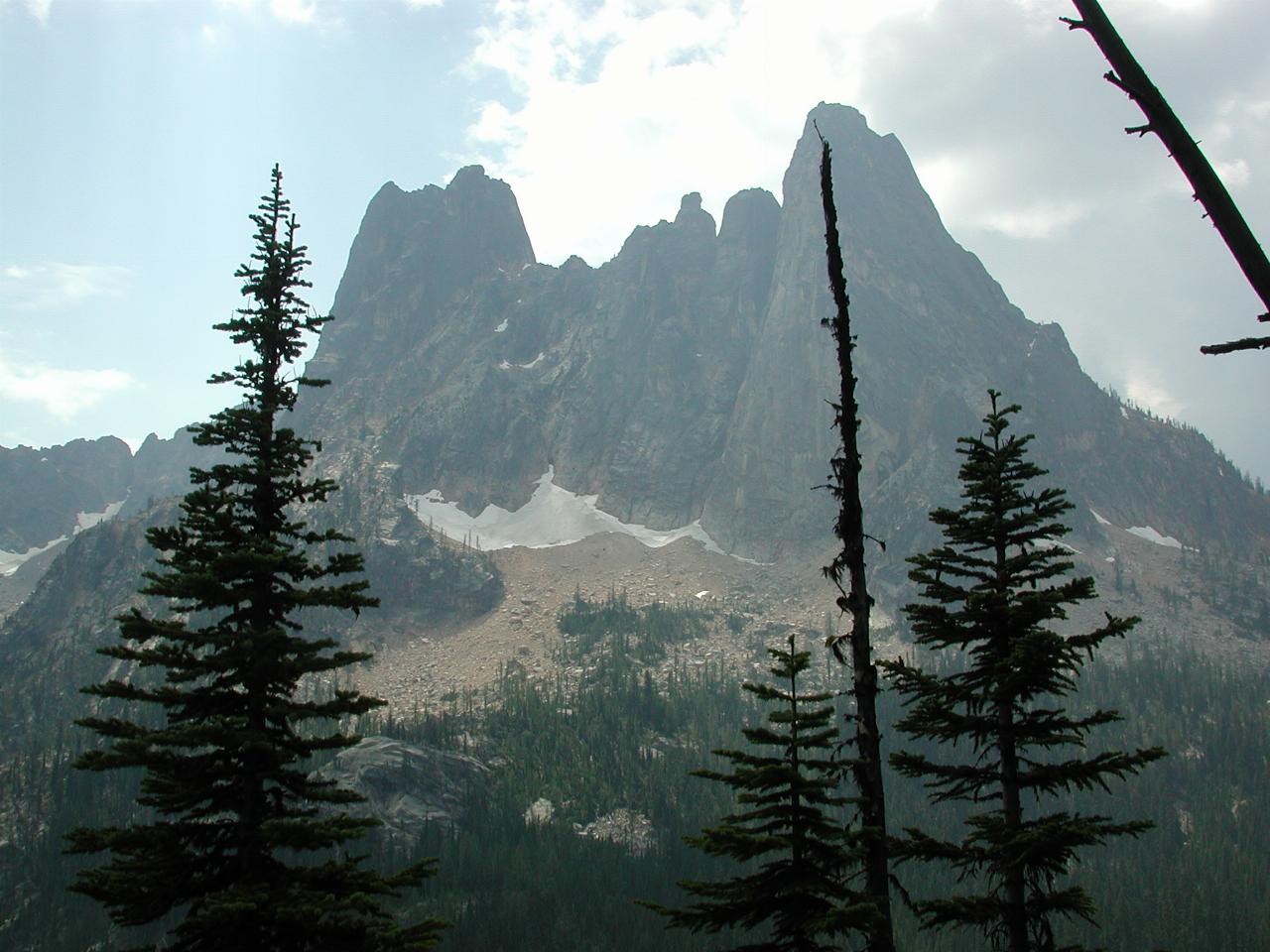 Rocky peaks atop mountain of trees