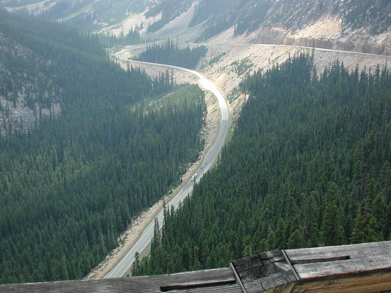 Distant road winding down side of mountain