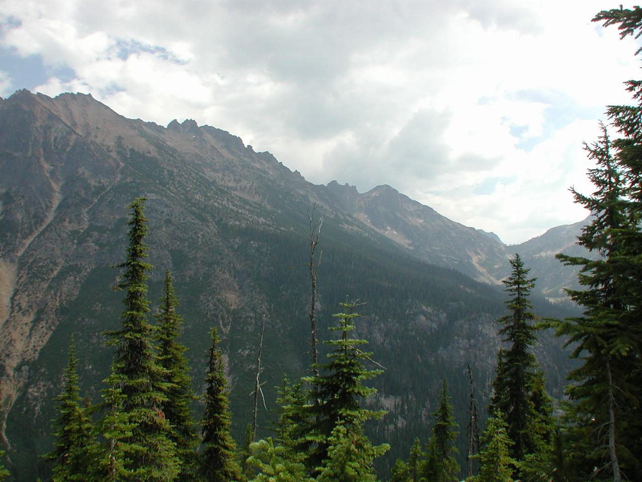 Mountaineous terrain, rocky with treed areas