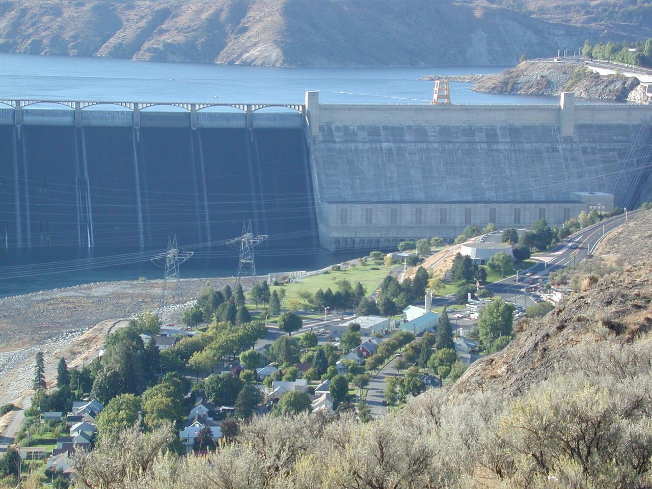 Close up of part spillway and dam wall, visitor centre and part of Columbia River Inn motel and Coulee Dam City