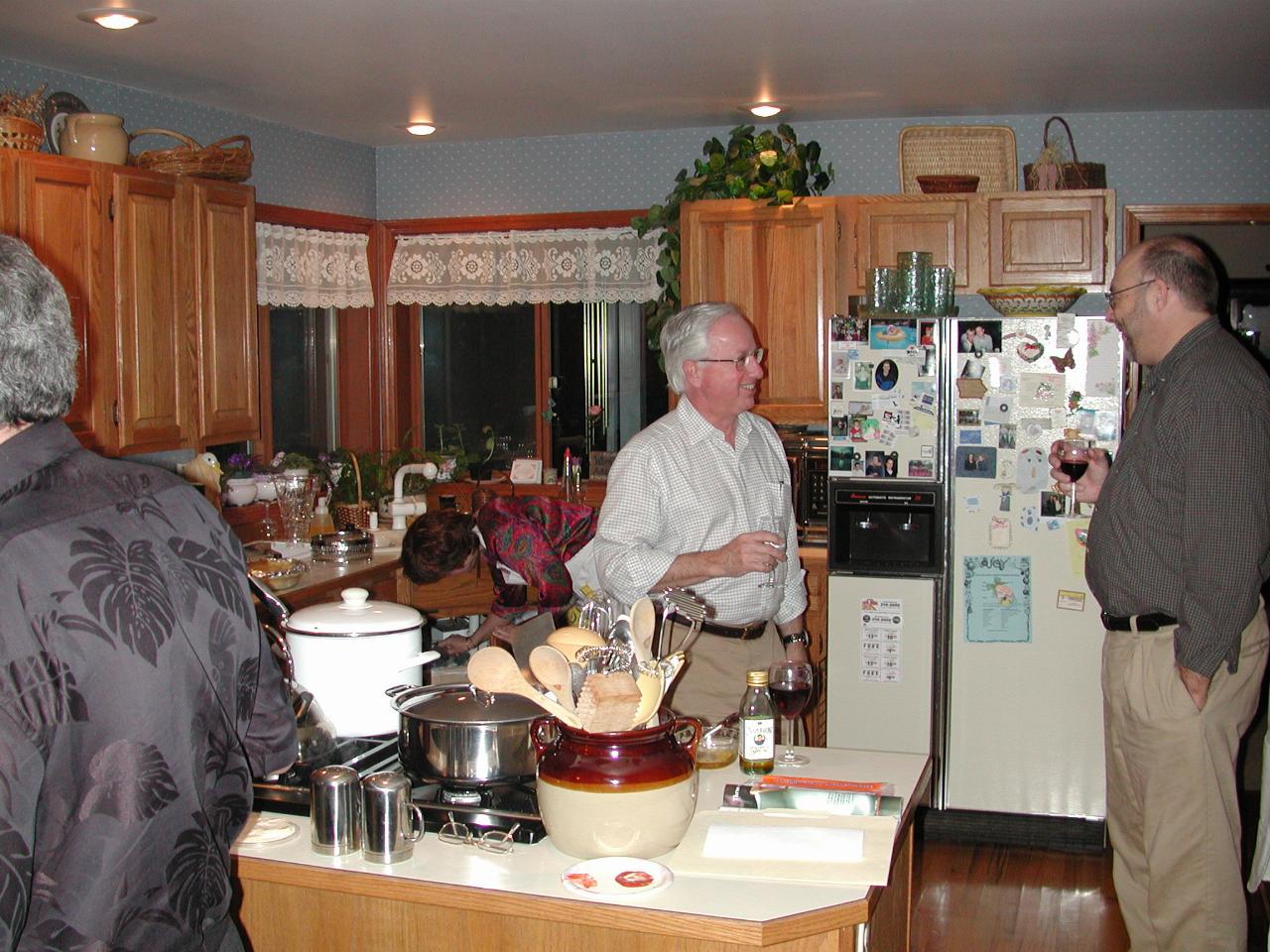 Cap'n Brad (back to camera), Sandy, Bill, Randy in the kitchen