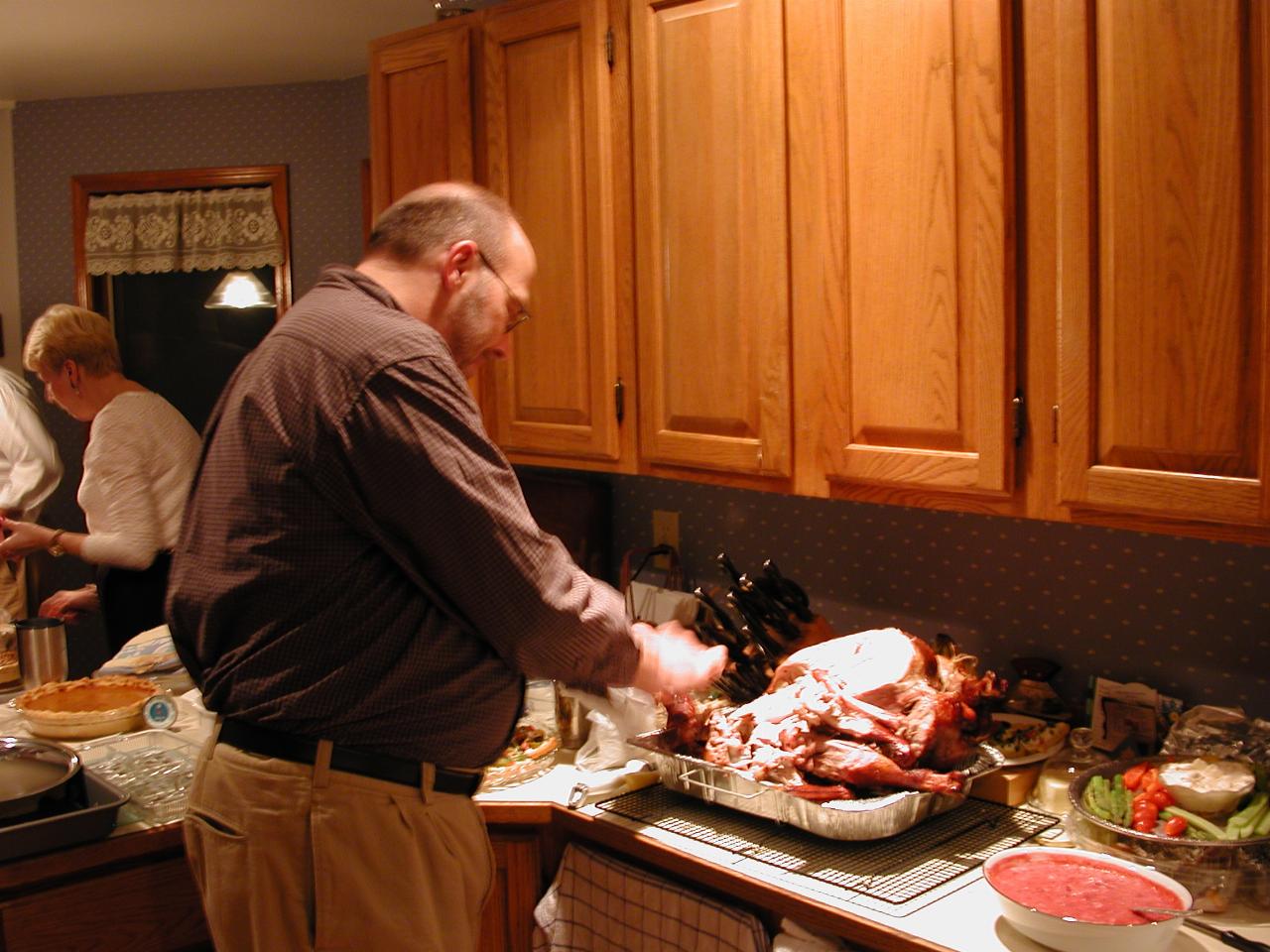 Randy starts to pull the turkey carcass apart for storage