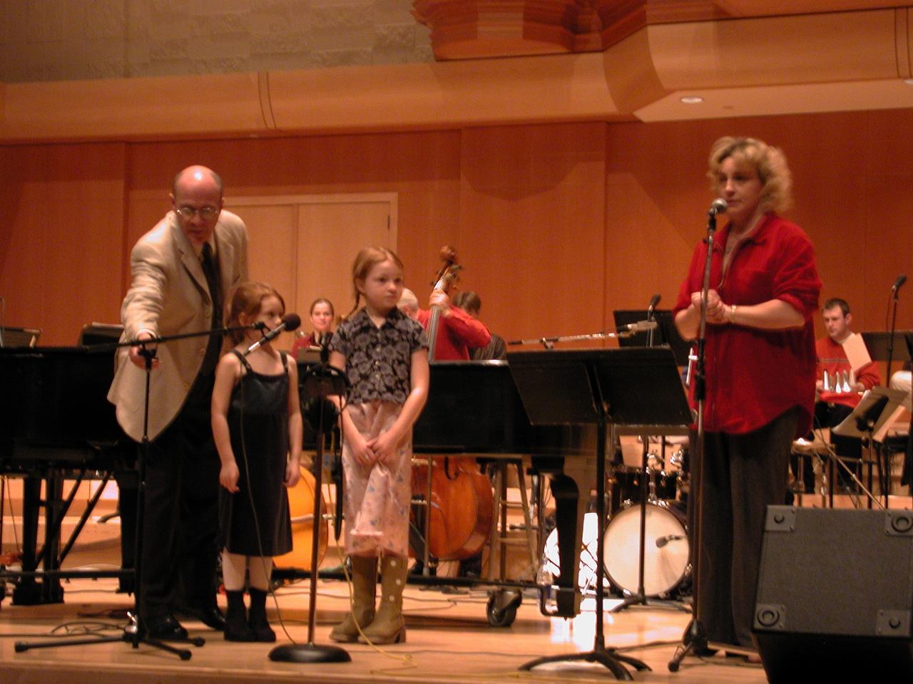 Greta Metassa - featured vocalist with her children as Nick adjusts microphone