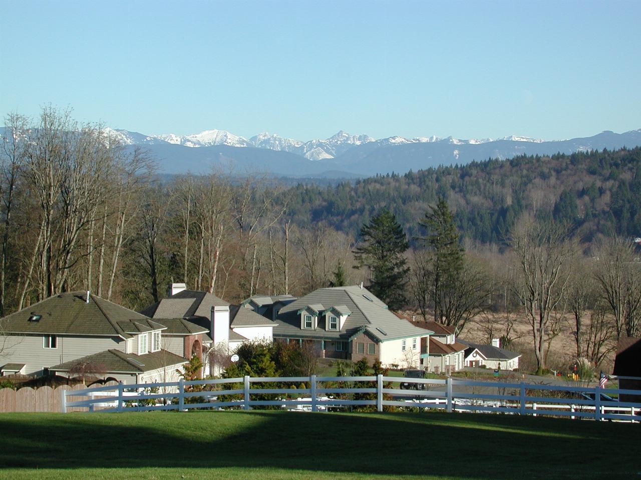 Rural scene south of Snohomish, on the edges of urban Seattle, wihth snow capped peaks from the Cascades