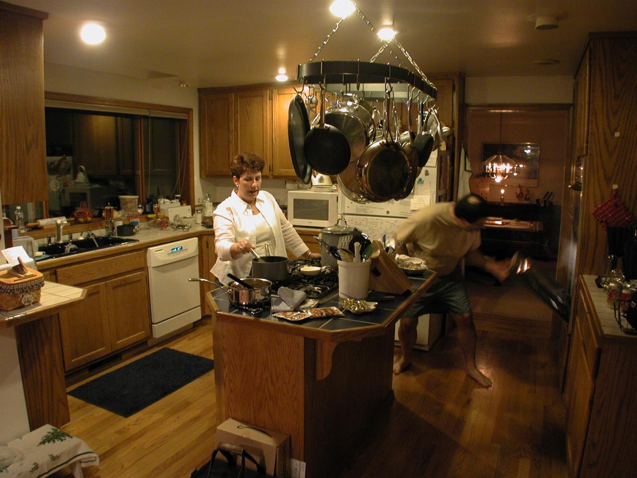 The hostess and host (inspecting the turkey)