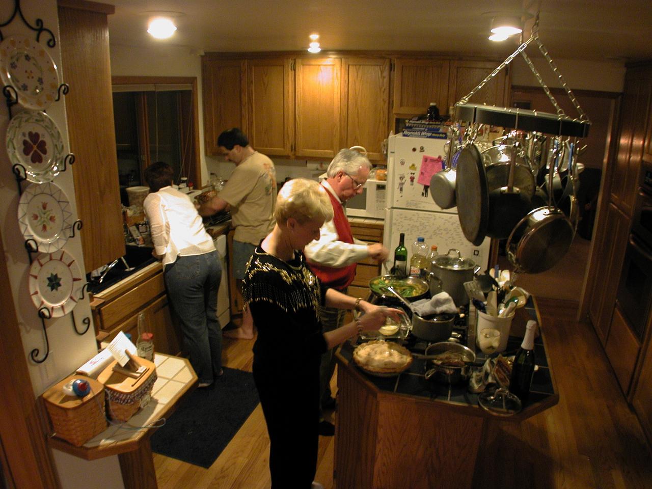 Patty and Rick attend the bird, Judy and Bill preparing on the cook top