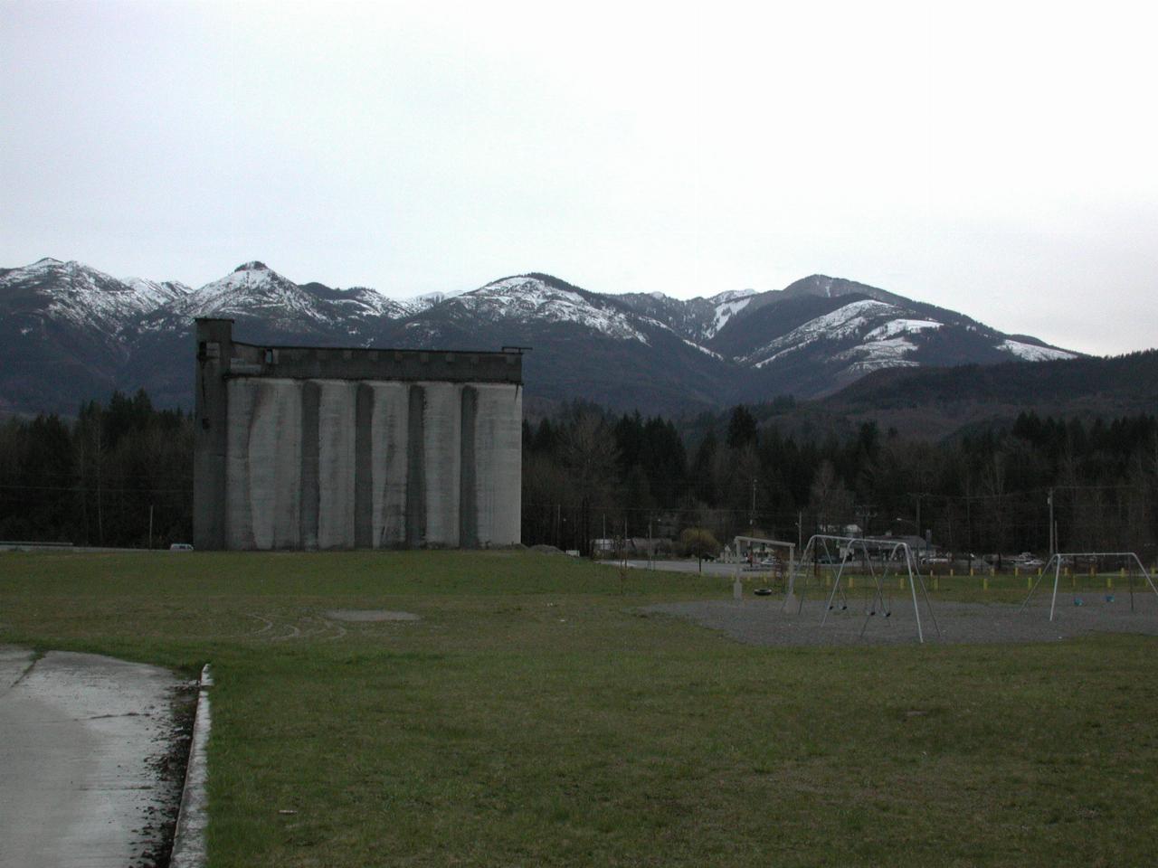 Concrete silos, not decaying, in Concrete, with snowy peaks