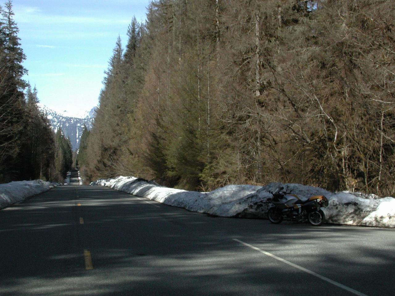 Riding down a snow edged corridor, north of Upper Baker Dam