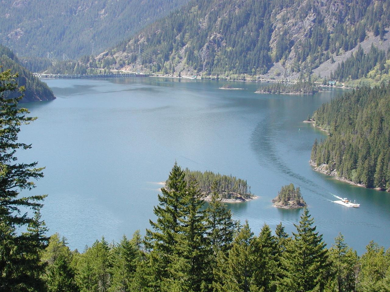 Barge moving a truck along Diablo Lake