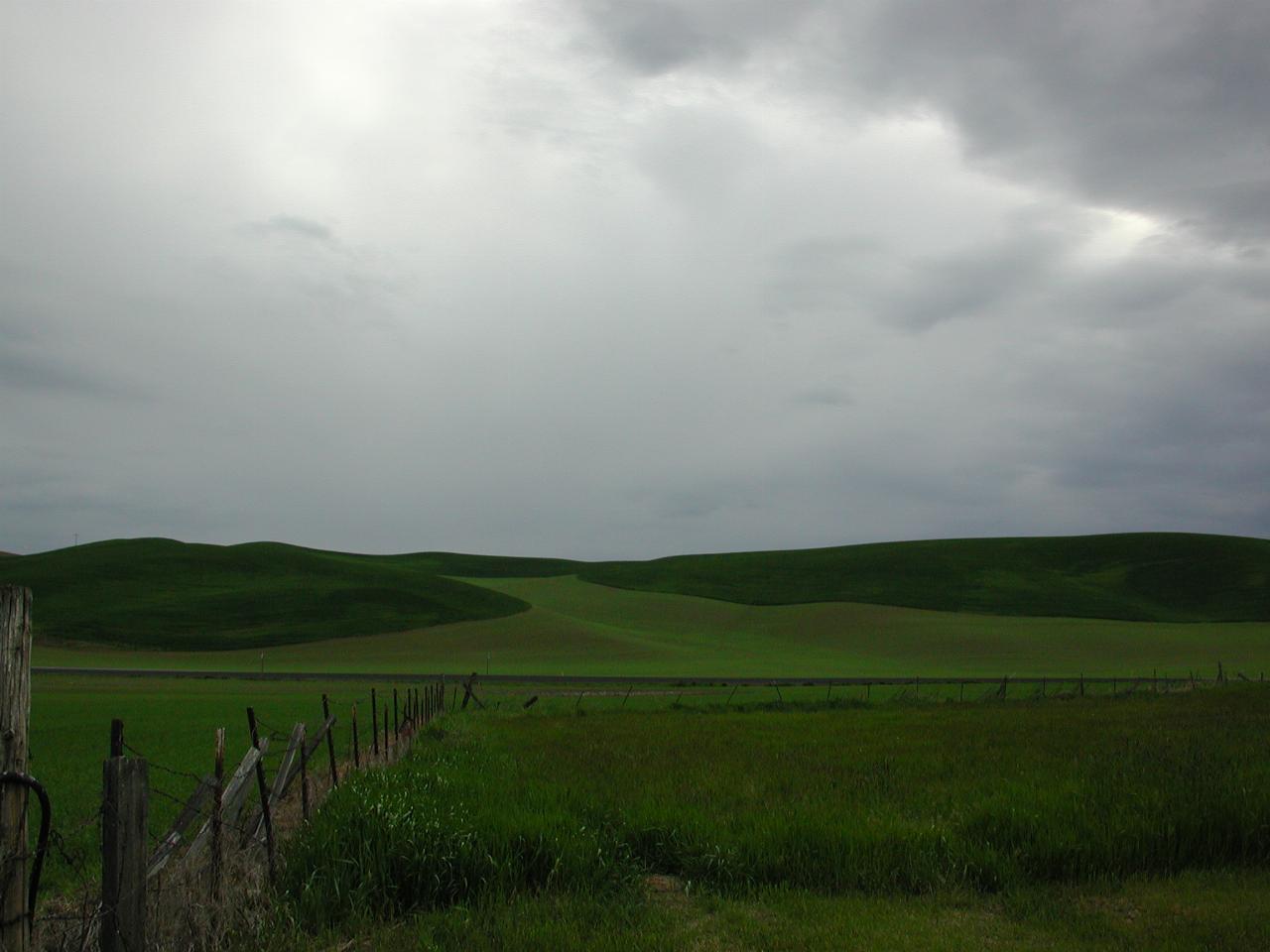 Looking west across US195 from Thompson's farm - storm coming over the rolling hills