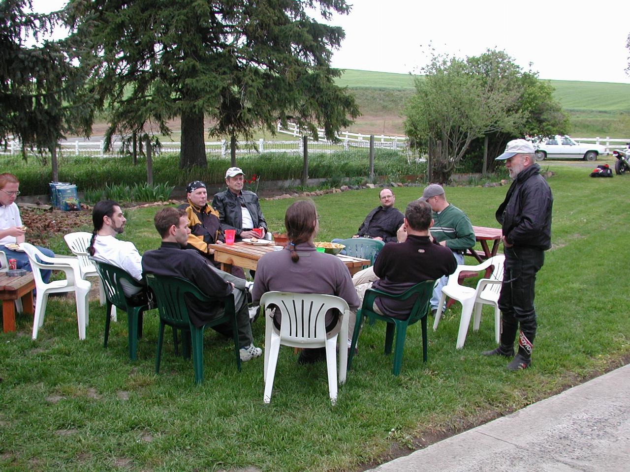 Assorted riders from Saturday's rides relaxing after munching at Thompson's farm