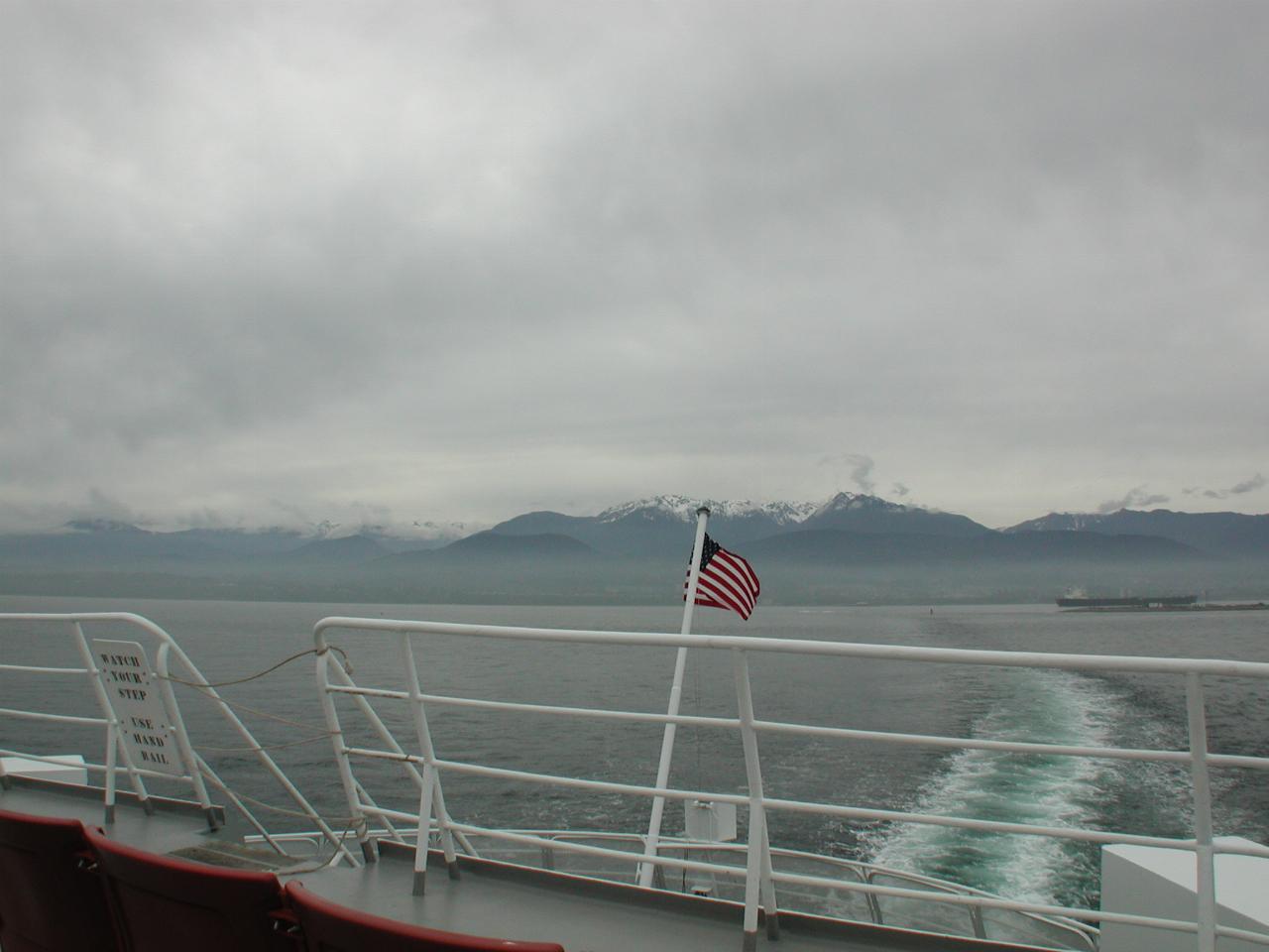 Olympic Mountains and Port Angeles vanishing in the distance from MV Coho