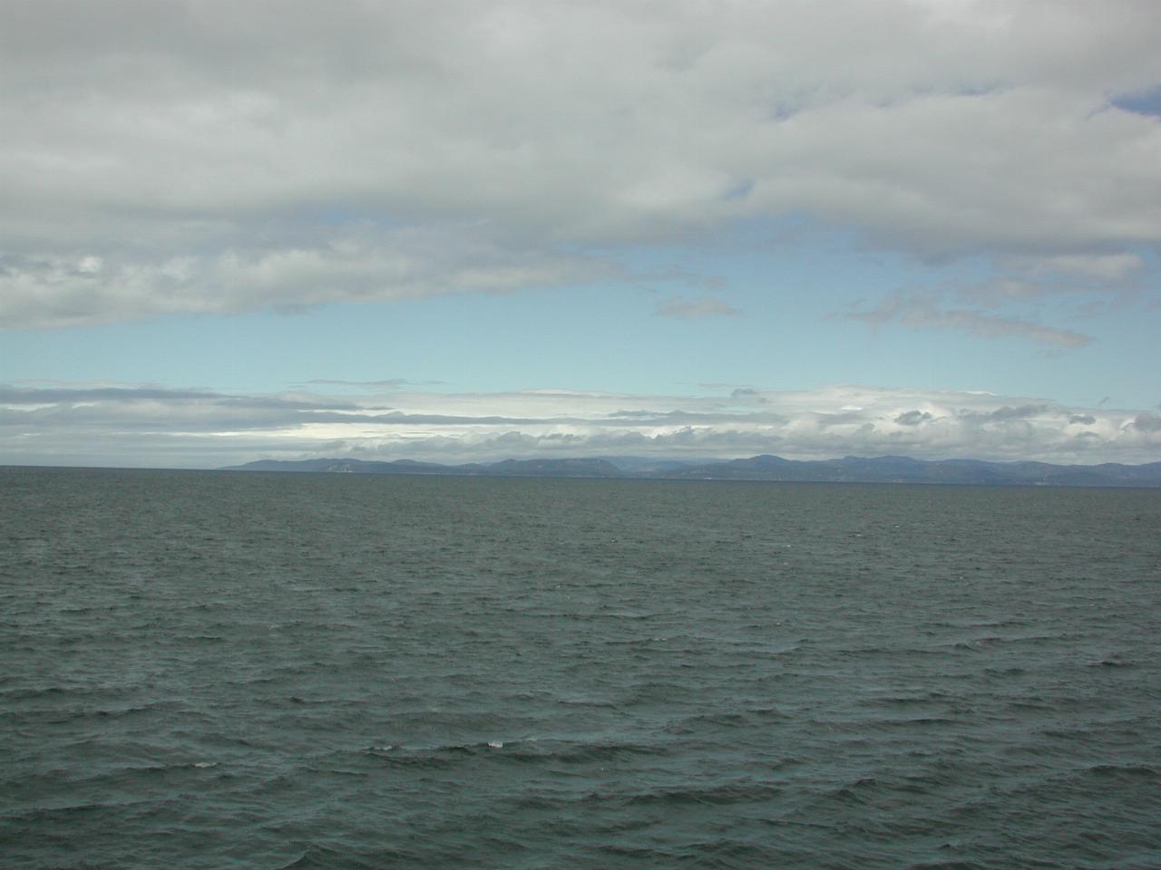 Blue sky to the east over the Olympic Peninsula, from MV Coho on Strait of Juan de Fuca