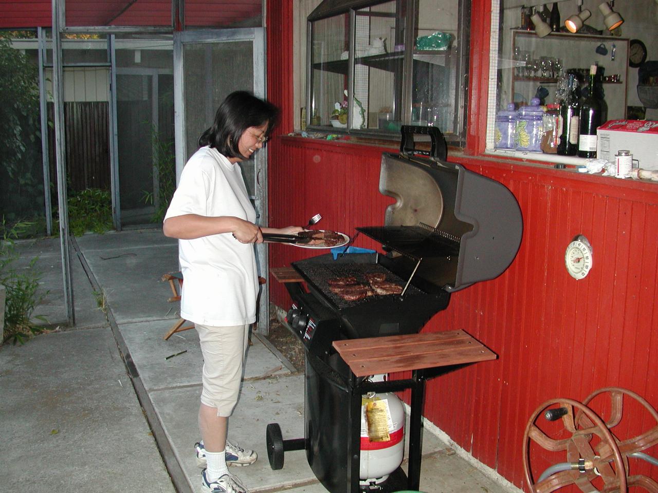 Kathy Morton emptying the barbeque for dinner