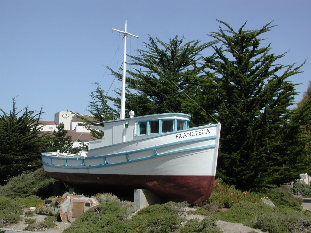 A retired fishing boat, on display at Monterey marina; note small size