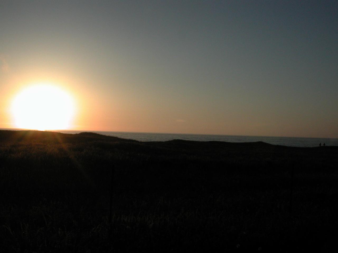 Sunset over the Pacific Ocean from the front lawn of Beach House Inn, Fort Bragg, California