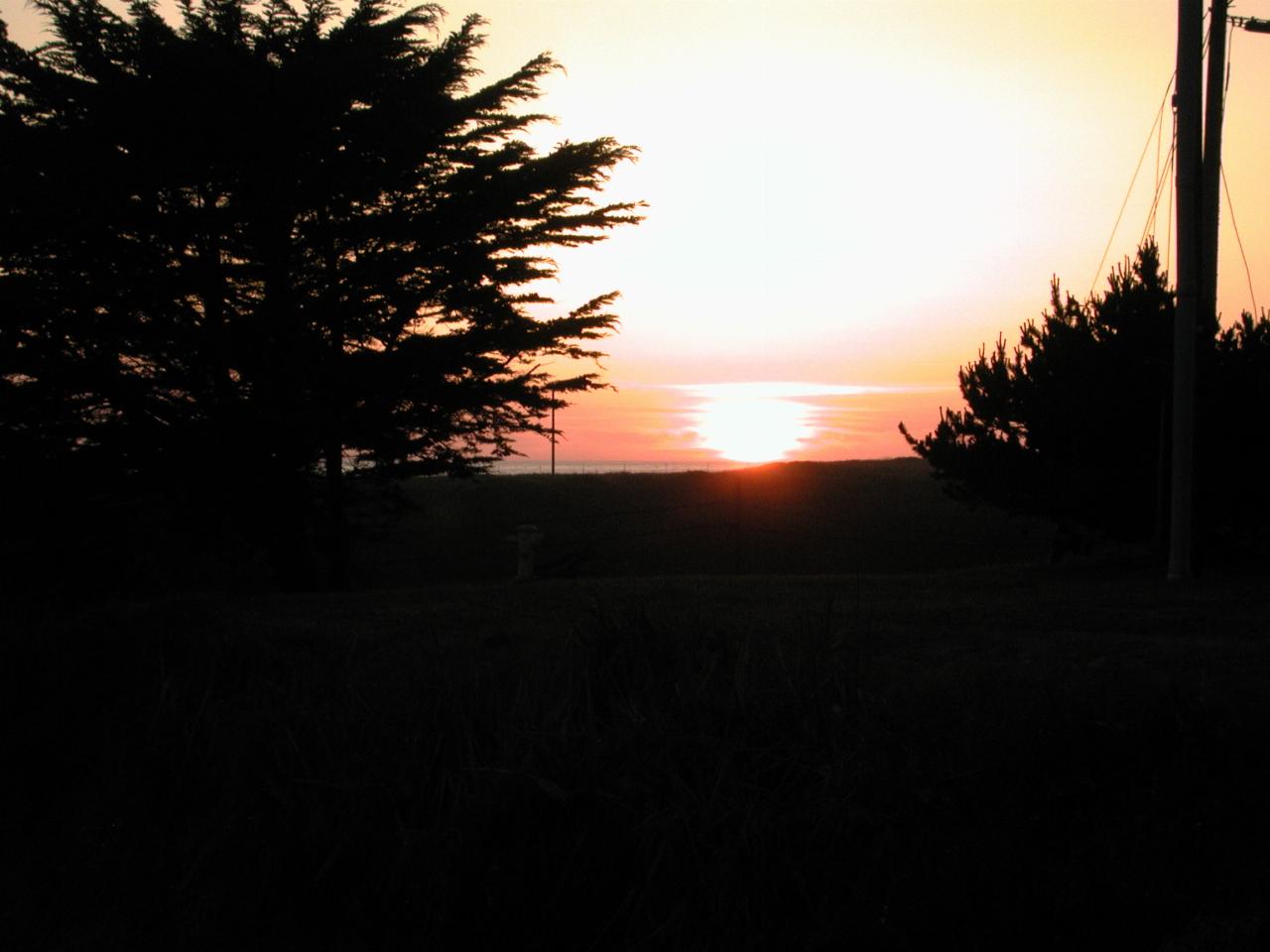 Sunset over the Pacific Ocean from the front lawn of Beach House Inn, Fort Bragg, California