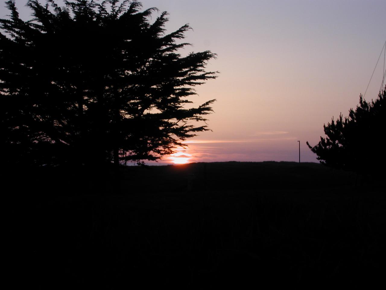 Sunset over the Pacific Ocean from the front lawn of Beach House Inn, Fort Bragg, California