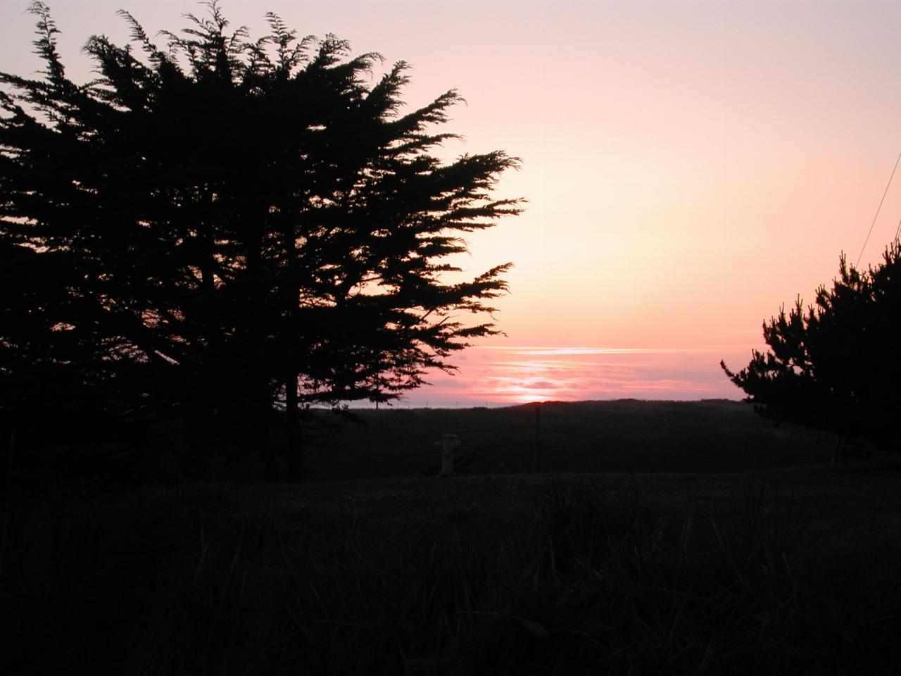 Sunset over the Pacific Ocean from the front lawn of Beach House Inn, Fort Bragg, California