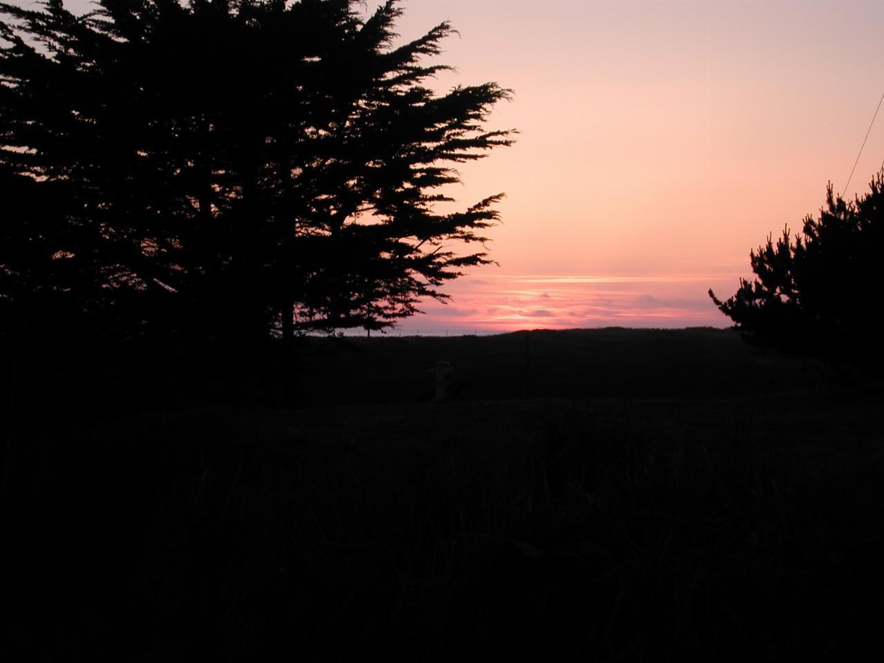 Sunset over the Pacific Ocean from the front lawn of Beach House Inn, Fort Bragg, California