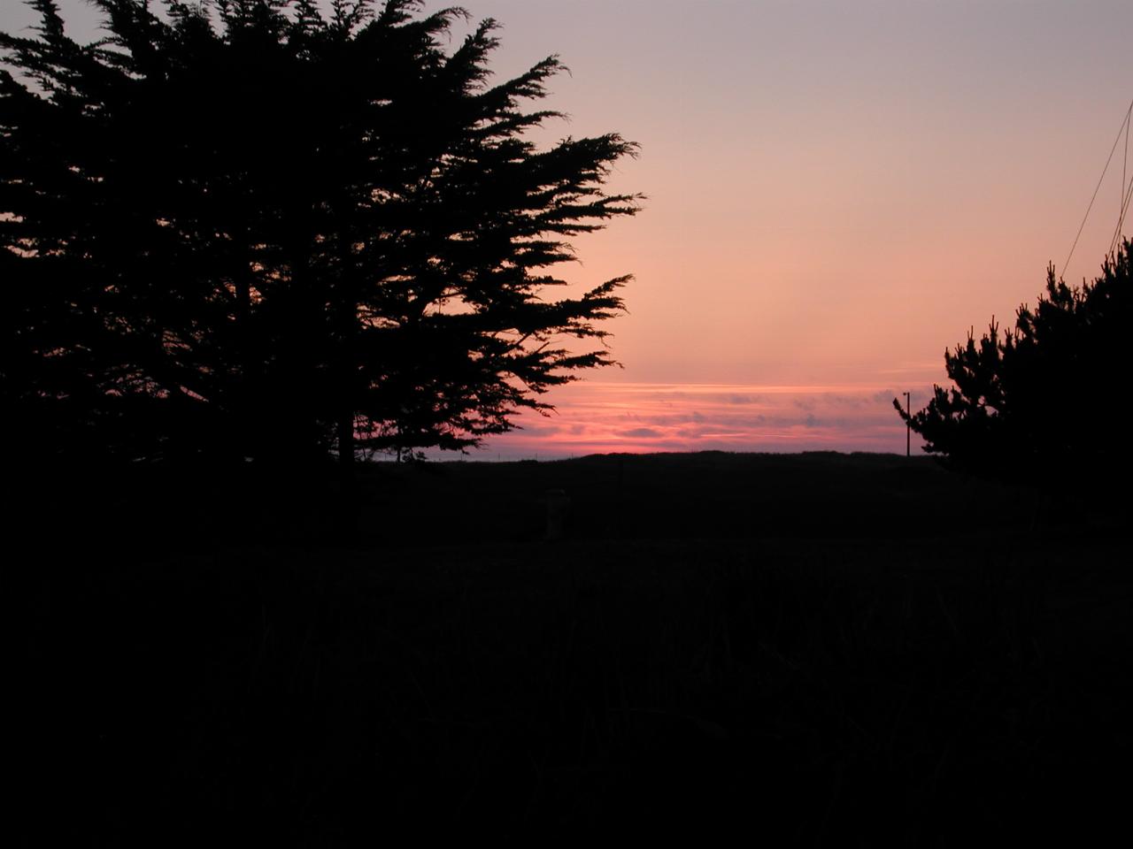 Sunset over the Pacific Ocean from the front lawn of Beach House Inn, Fort Bragg, California